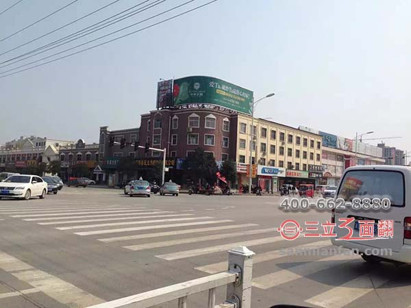 河北省邯鄲市叢臺(tái)區(qū)樓頂三面翻圓弧形廣告牌案例施工圖片